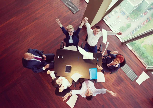 top view of  business people group on meeting throwing documents in air