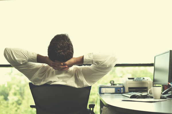 happy young business man at office