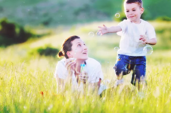 Happy child and woman outdoor — Stock Photo, Image
