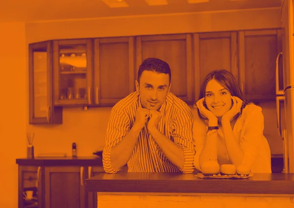 Happy young couple have fun in modern kitchen — Stock Photo, Image