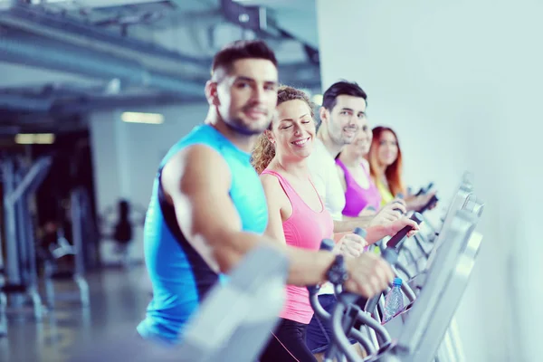 Group of people running on treadmills — Stock Photo, Image