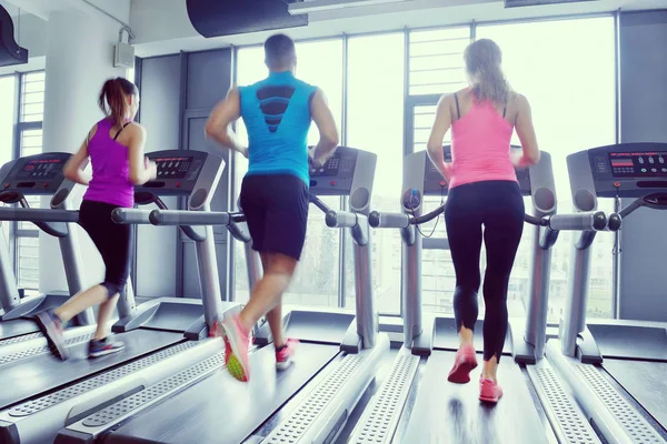 Group of people running on treadmills — Stock Photo, Image