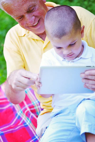 Grandfather Child Park Using Tablet Computer — Stock Photo, Image