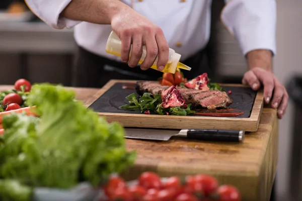 Chef Male Hands Finishing Serve Steak Plate Oil — Stock Photo, Image