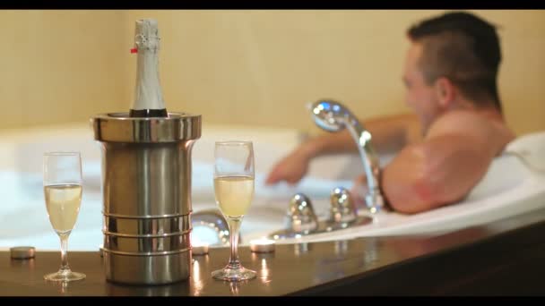 Young Handsome Man Enjoys Relaxing Jacuzzi Candles Champagne Luxury Resort — Stock Video