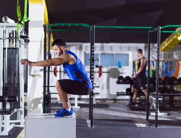 Man working out jumping on fit box — Stock Photo, Image