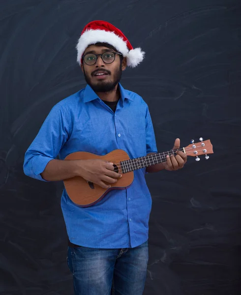 Santa playing Latin America traditional small guitar — ストック写真