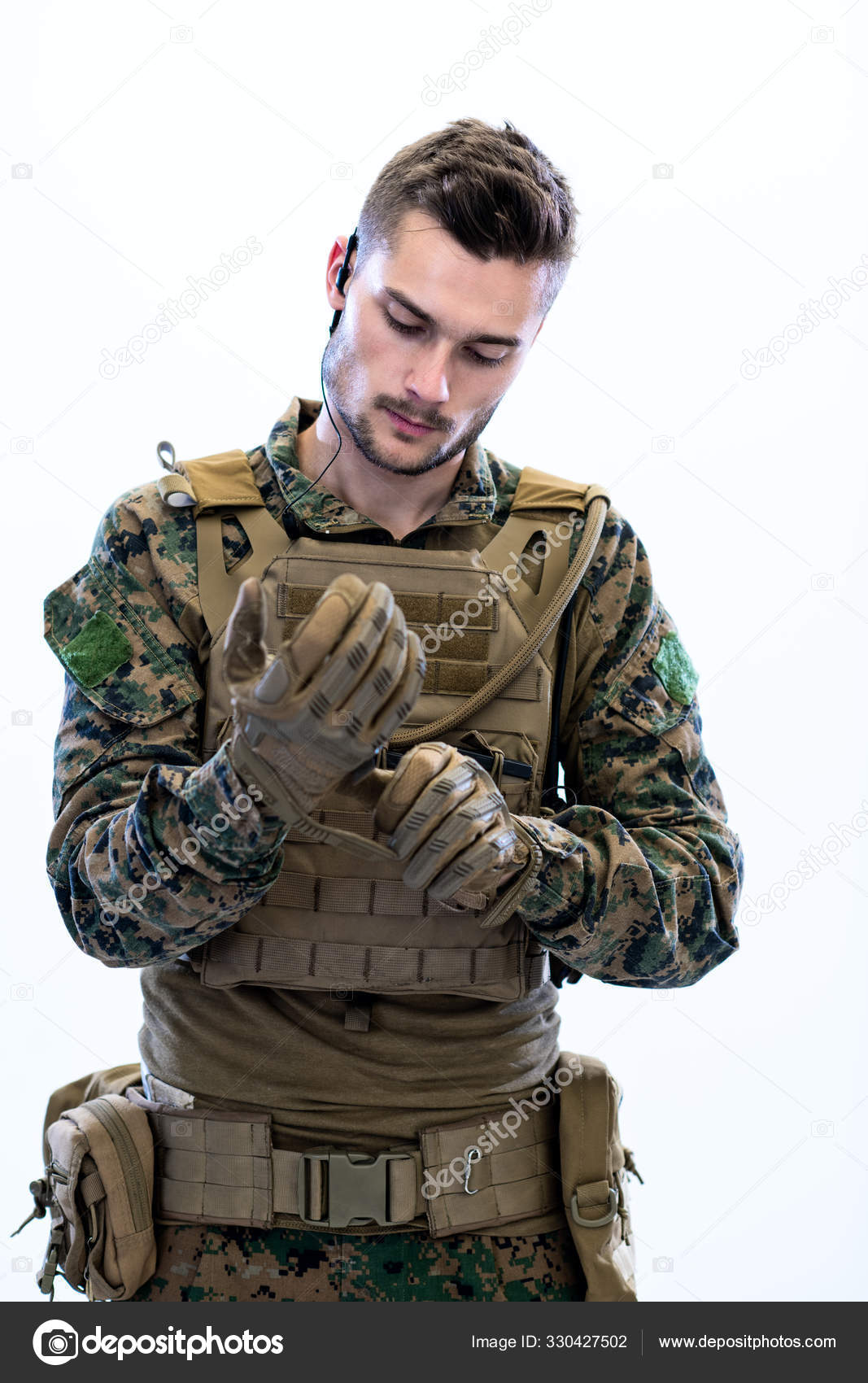 Closeup of soldier hands putting protective battle gloves — Stock