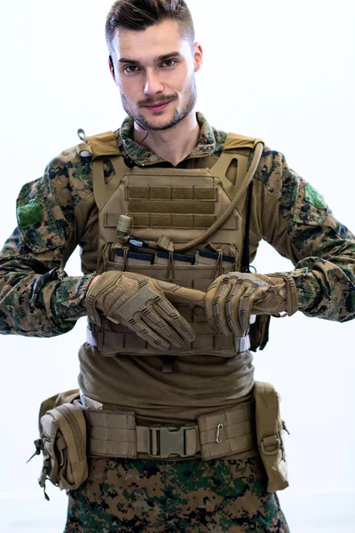 Closeup of soldier hands putting protective battle gloves — Stock Photo, Image