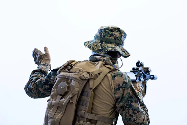 Soldier in action giving comands to team by hand sign — Stock Photo, Image