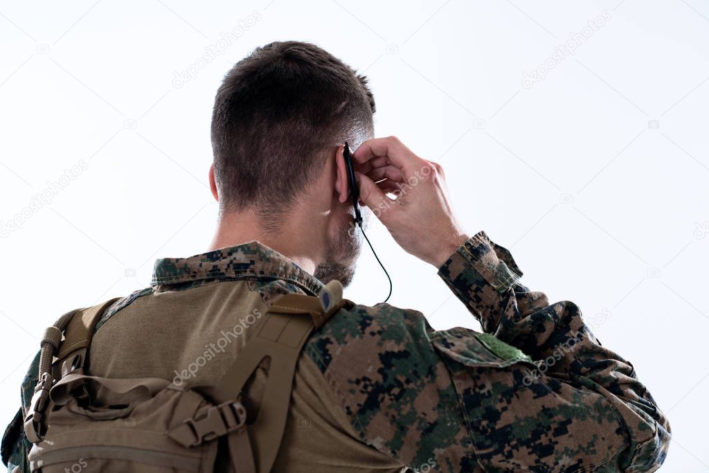 soldier preparing gear for action and checking communication