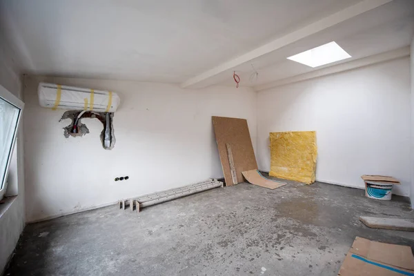 interior of construction site with drywall completely installed at new two level apartment  work in progress to the new house