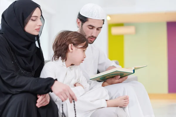Traditional Muslim Family Parents Children Reading Quran Praying Together Sofa Royalty Free Stock Images