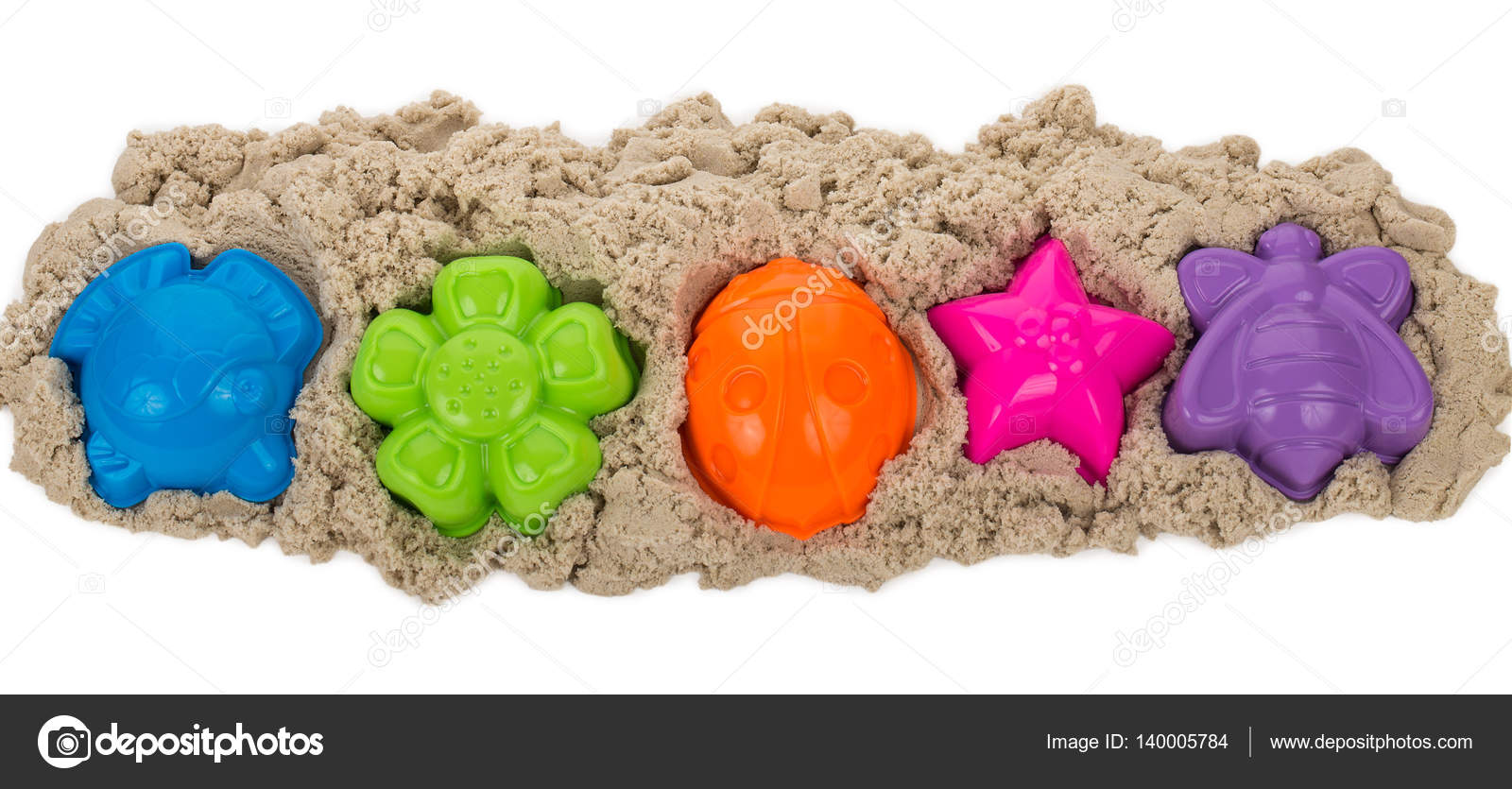 Kinetic sand with multicolored molds Stock Photo by ©Alekcey 140005784