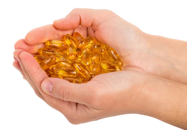 Cápsulas de omega 3 en las manos — Foto de Stock