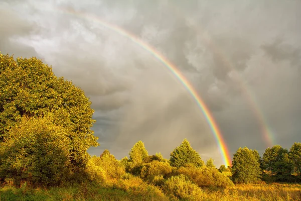 Beautiful rainbow in sky — Stock Photo, Image