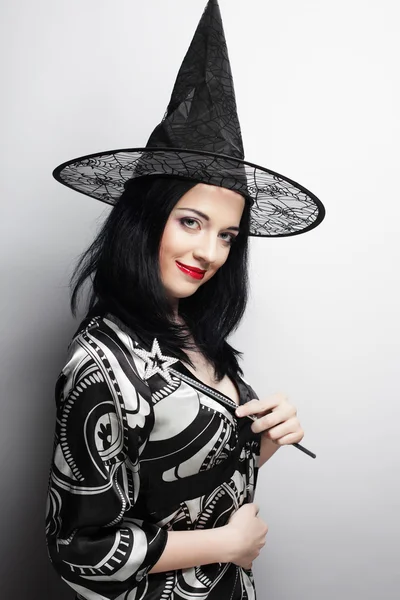 Funny Witch. Young happy woman with canival hat. — Stock Photo, Image