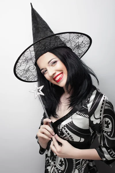 Funny Witch. Young happy woman with canival hat. — Stock Photo, Image