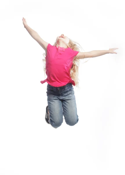 Κορίτσι πηδά σε λευκό φόντο — Φωτογραφία Αρχείου