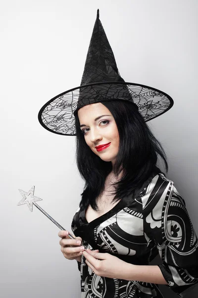 Funny Witch. Young happy woman with canival hat. — Stock Photo, Image