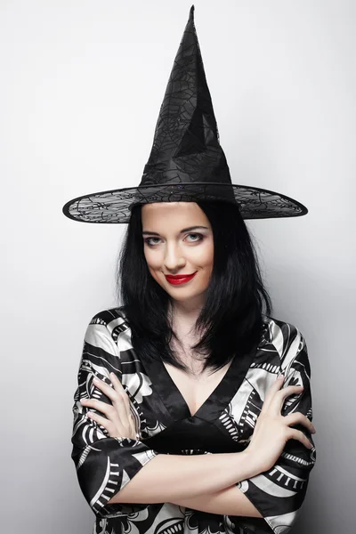 Funny Witch. Young happy woman with canival hat. — Stock Photo, Image