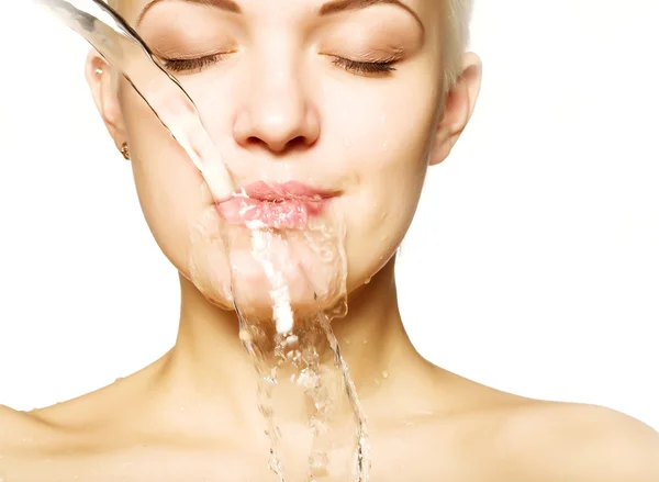 Beautiful woman with clean skin with splash of water Stock Image