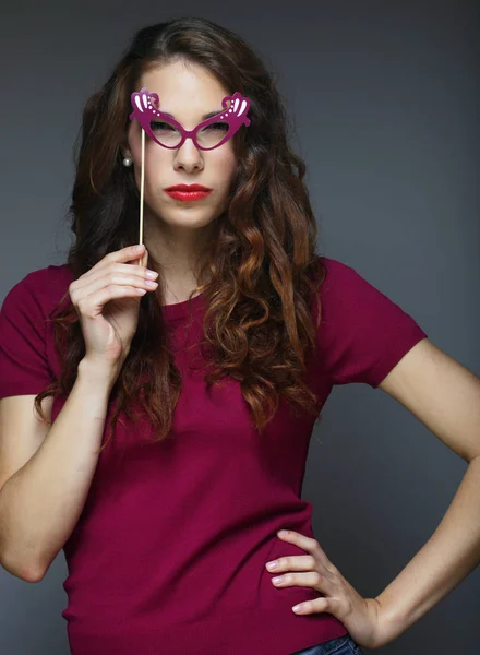 Attractive playful young woman with false glasses — Stock Photo, Image