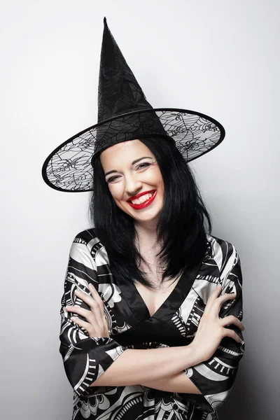 Funny Witch. Young happy woman with canival hat. — Stock Photo, Image