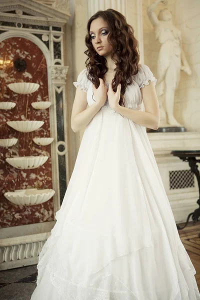 Portrait of a beautiful young victorian lady in white dress — Stock Photo, Image