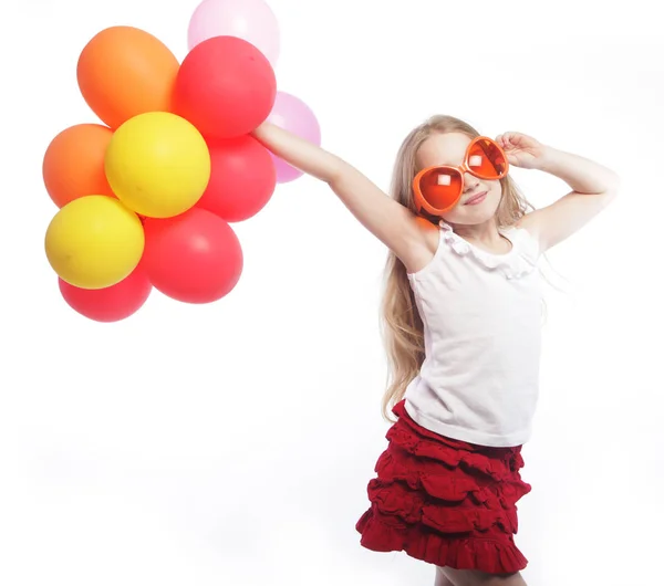 Girl with balloons and orange sunglasses — Stock Photo, Image