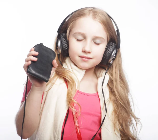 Cute happy little girl with headphones — Stock Photo, Image