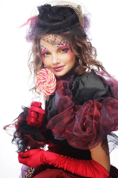 Κορίτσι με δημιουργική make-up κρατά γλειφιτζούρι. — Φωτογραφία Αρχείου