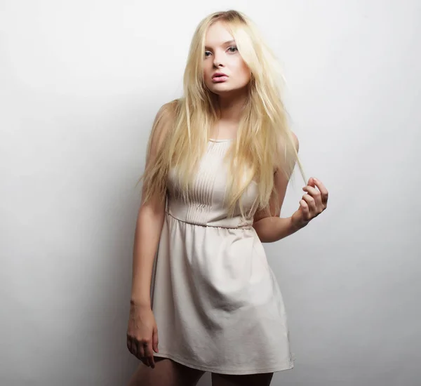 Young magnificent woman in white dress. Royalty Free Stock Images