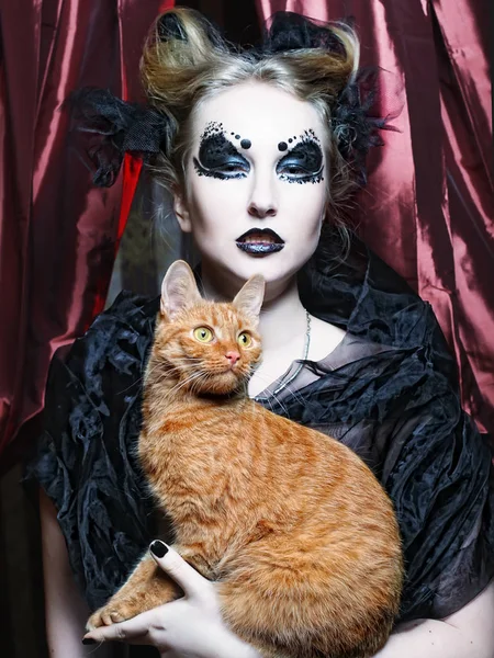Dark vampire woman with cat — Stock Photo, Image