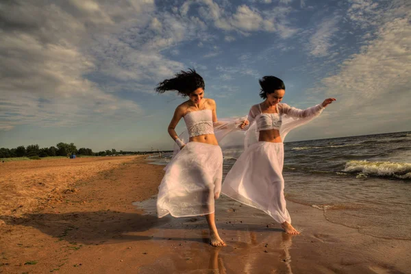 Two white angels on the beach — Stock Photo, Image