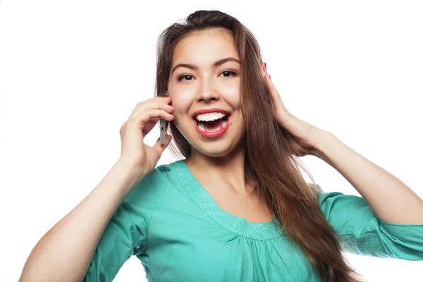 Cheerful woman talking on the phone isolated on a white backgrou — Stock Photo, Image