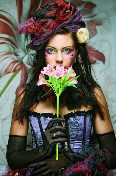 Woman with creative make-up in doll style with flower — Stock Photo, Image