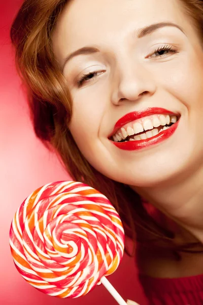 Portrait of young woman with lollipop — Stock Photo, Image