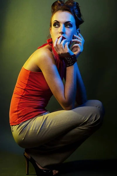 Young fashion model posing in studio — Stock Photo, Image