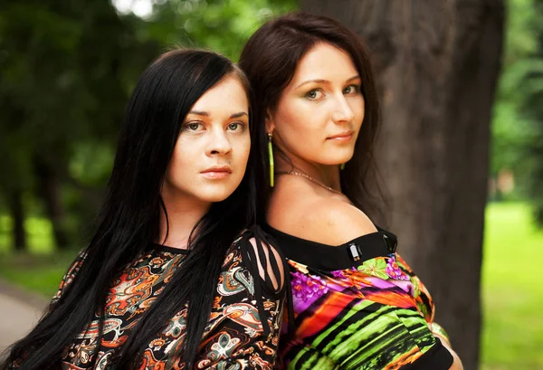 Outdoor portrait of two young women — Stock Photo, Image