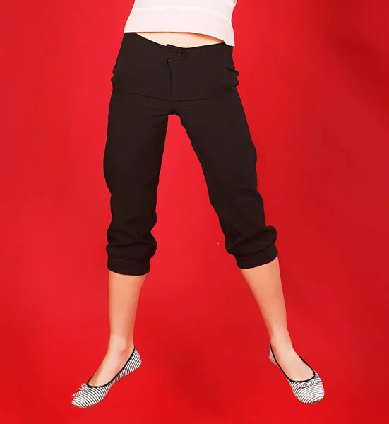Woman legs on red background — Stock Photo, Image