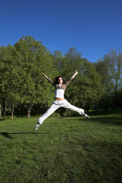 Slim shaped beautiful girl jumping — Stock Photo, Image