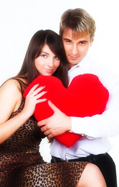 Feliz pareja sonriendo sobre un fondo blanco — Foto de Stock