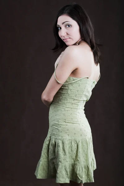 Pretty woman in green dress — Stock Photo, Image