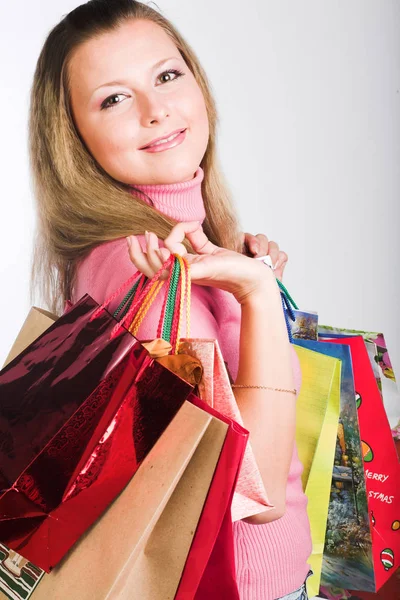 Compras mujer joven sobre fondo blanco — Foto de Stock