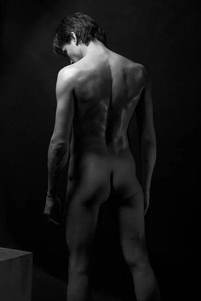 naked man standing back