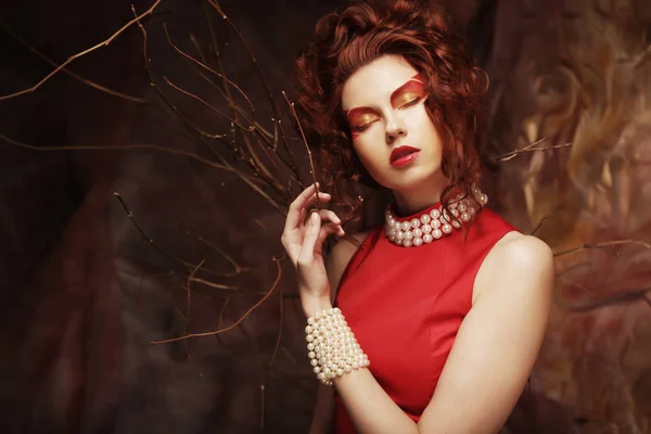 Young woman in red dress — Stock Photo, Image