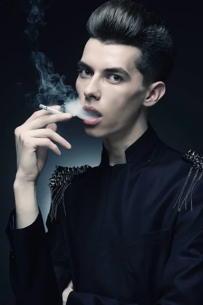 Young stylish man smoking a cigarette — Stock Photo, Image