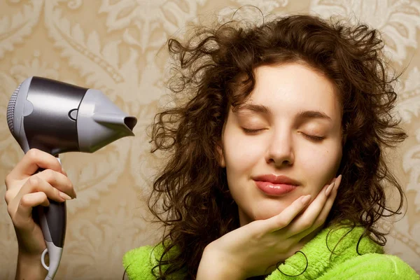 Woman drying her hair with hairdryer — Stock Photo, Image