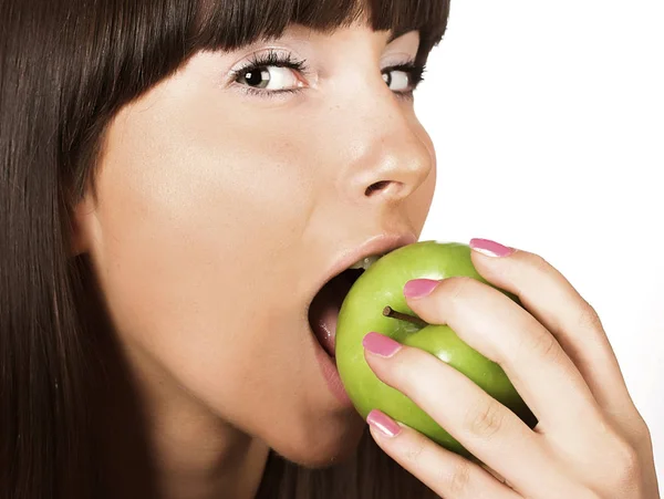 Young girl eating apple — Stock Photo, Image